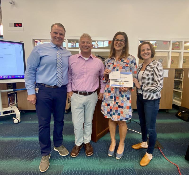 Beacon Middle substitute teacher Adrienne Fyock received the GEM award for April. Gathered are (l-r) Cape Superintendent Bob Fulton, Beacon Middle Principal Dave Frederick, Fyock, and school board President Alison Myers.